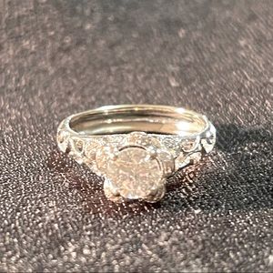 Size 9 Parade 18kt white gold band with 1.04t center diamond
